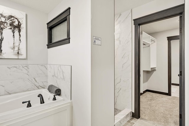 1105 136th St E, Rosemount, MN 55068 - full bathroom featuring a bath, a walk in shower, and baseboards