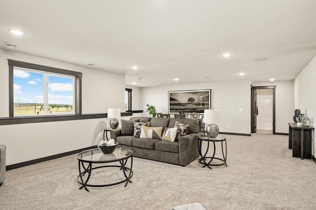 1105 136th St E, Rosemount, MN 55068 - living area featuring light colored carpet, baseboards, and recessed lighting