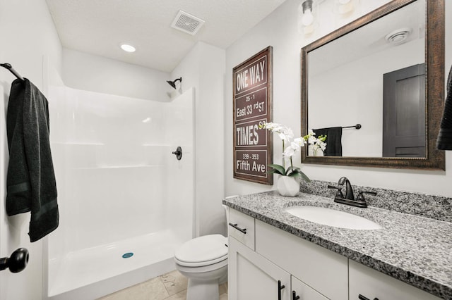 1105 136th St E, Rosemount, MN 55068 - bathroom with vanity, a shower, toilet, and tile patterned floors