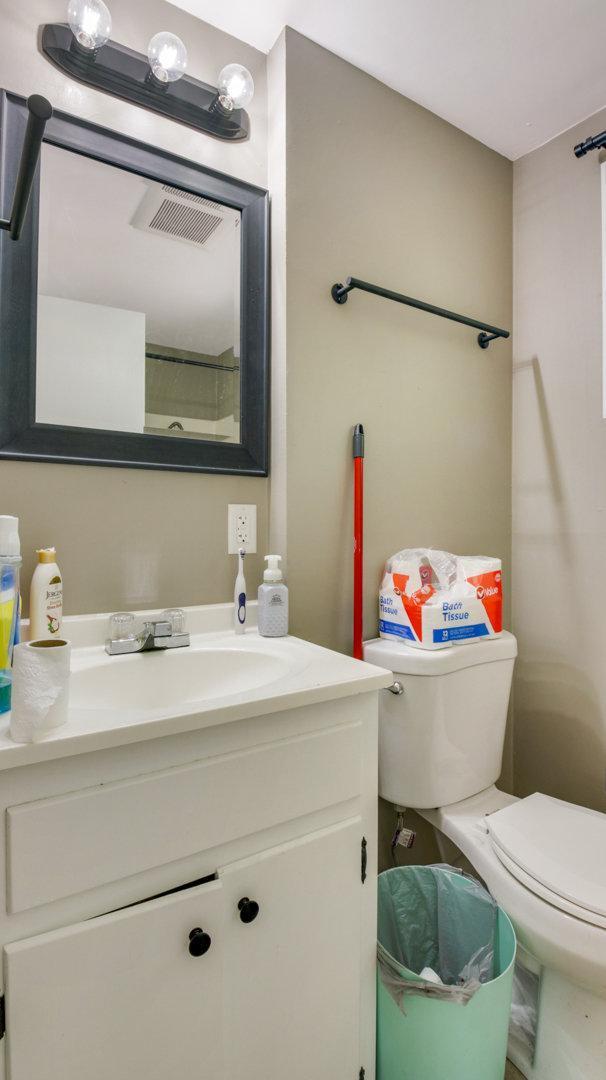 bathroom featuring vanity and toilet