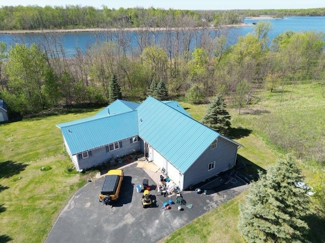 aerial view featuring a water view and a view of trees