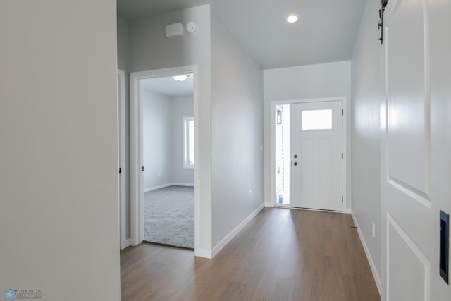 foyer entrance with light hardwood / wood-style floors