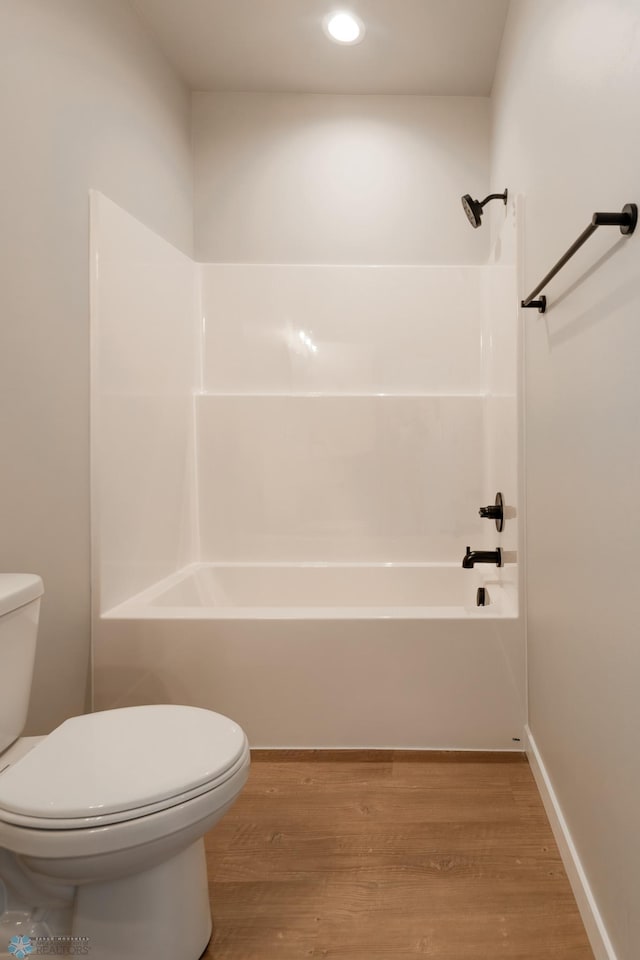 bathroom featuring wood-type flooring and toilet