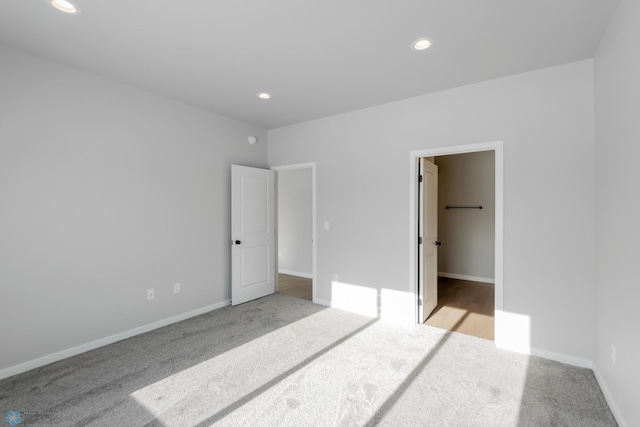 carpeted bedroom featuring a spacious closet