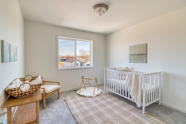 carpeted bedroom with a crib