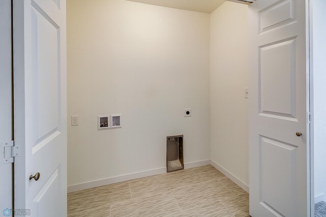 washroom with hookup for a washing machine, light tile patterned floors, and hookup for an electric dryer