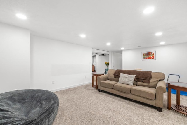 living area featuring light carpet, baseboards, and recessed lighting