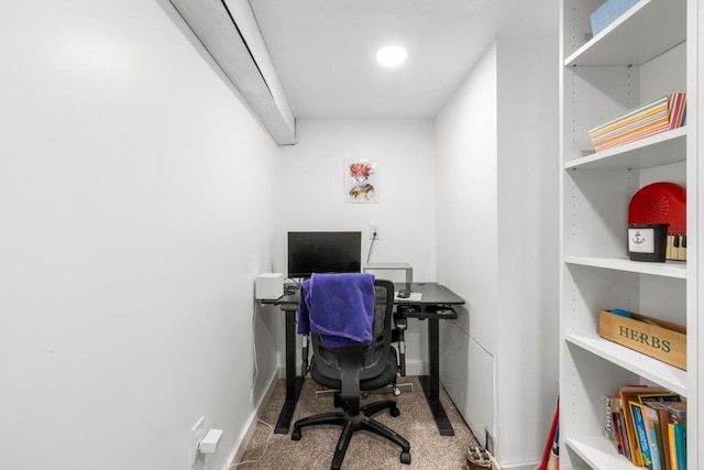 carpeted office featuring baseboards