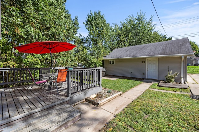 deck with outdoor dining space and a lawn