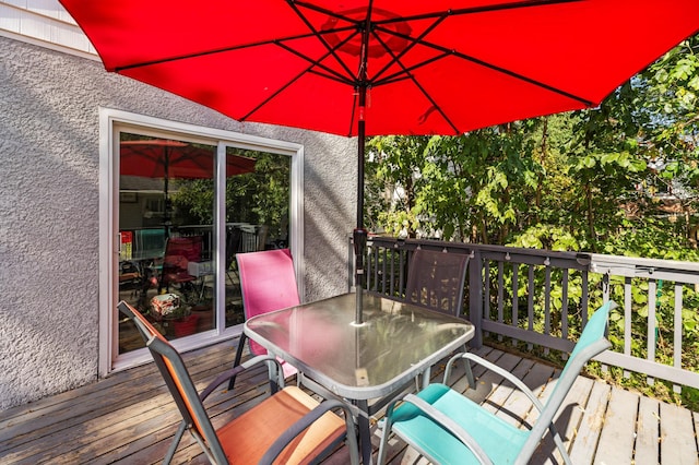 wooden deck with outdoor dining space