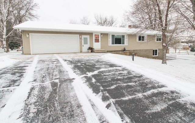 single story home with a garage