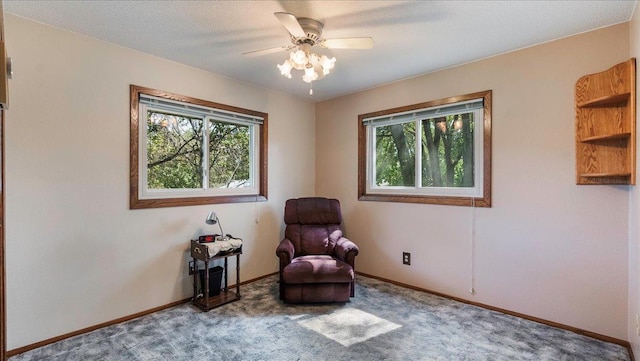 unfurnished room featuring carpet floors, a healthy amount of sunlight, ceiling fan, and baseboards