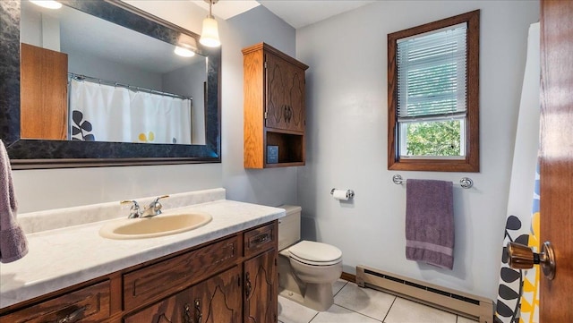 full bathroom featuring baseboards, toilet, a baseboard radiator, tile patterned flooring, and vanity