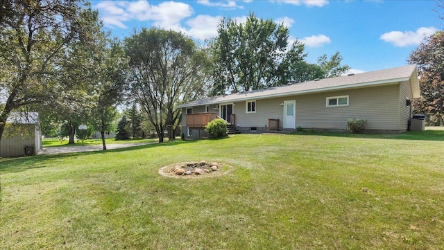 rear view of house featuring a yard