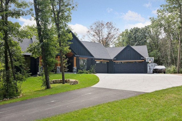 3028 Pinewood Rd SE, Rochester, MN 55904 - view of front facade featuring board and batten siding, an attached garage, driveway, and a front yard