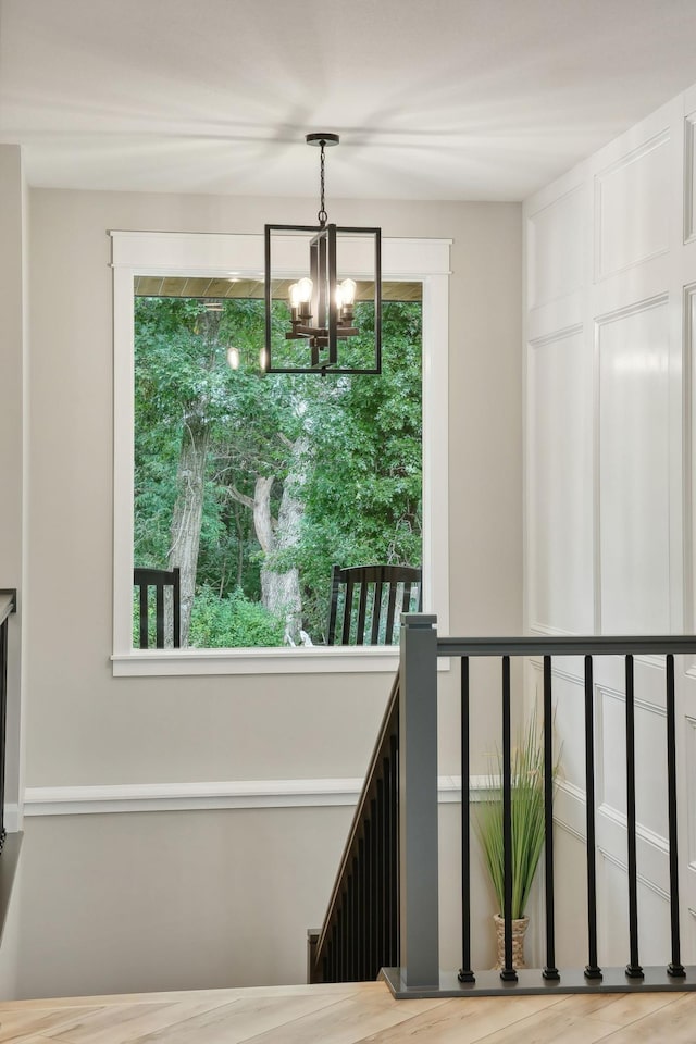 3028 Pinewood Rd SE, Rochester, MN 55904 - stairway featuring a chandelier