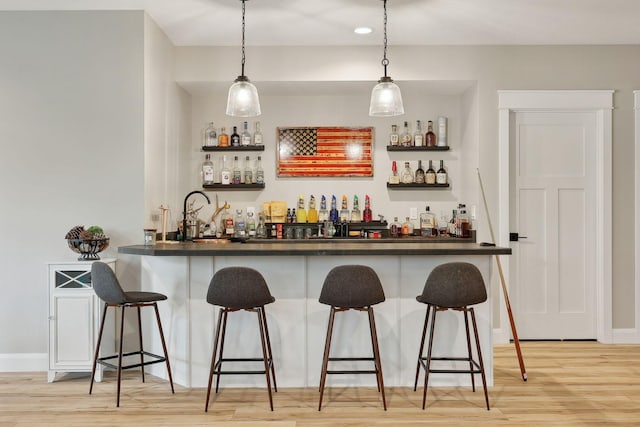 3028 Pinewood Rd SE, Rochester, MN 55904 - indoor bar with light wood-style floors, decorative light fixtures, baseboards, and recessed lighting