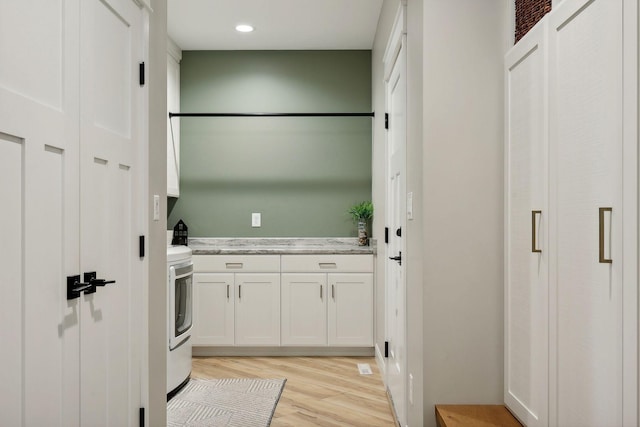 3028 Pinewood Rd SE, Rochester, MN 55904 - laundry room with cabinet space, light wood-style flooring, washer / clothes dryer, and recessed lighting