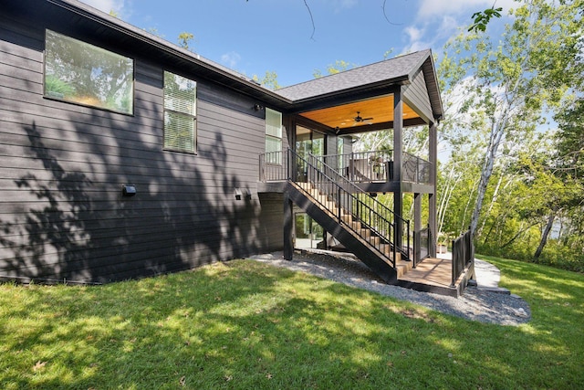 3028 Pinewood Rd SE, Rochester, MN 55904 - view of grassy yard featuring stairway and a ceiling fan