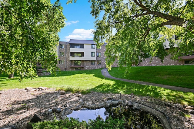 view of home's community featuring a yard