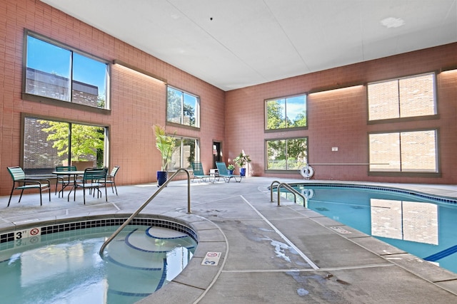 view of pool with an indoor in ground hot tub