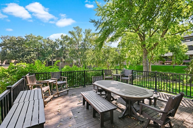 deck featuring a lawn