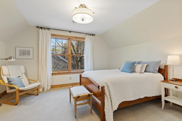 carpeted bedroom with vaulted ceiling