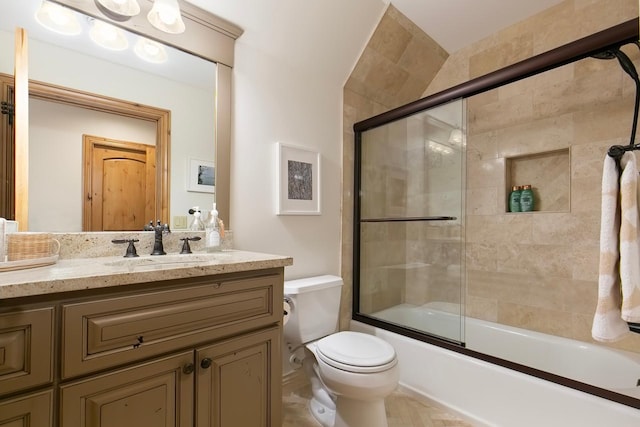 full bathroom with toilet, combined bath / shower with glass door, and vanity