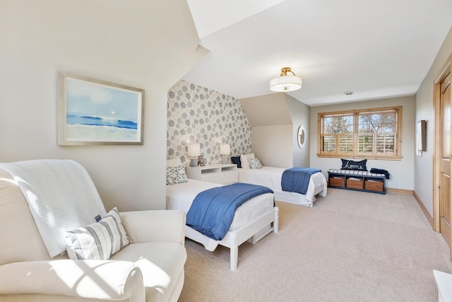 bedroom featuring light carpet and lofted ceiling