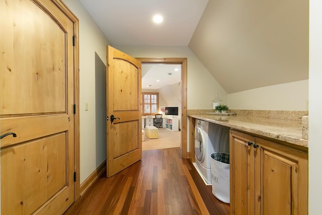 laundry area with washer and dryer and dark hardwood / wood-style floors