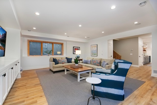 living room with light hardwood / wood-style floors