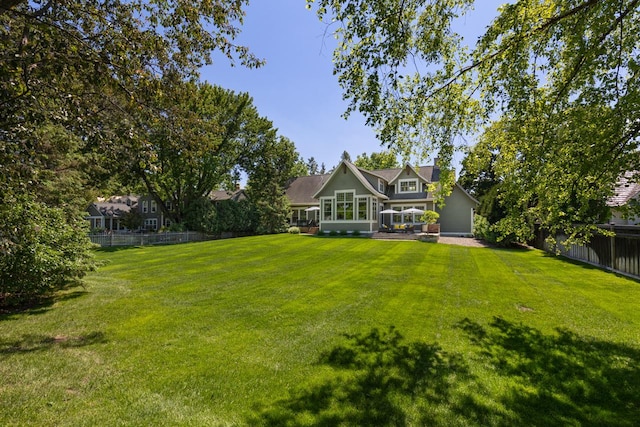 view of yard with a sunroom