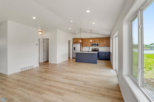 7043 Benji Ln, Fargo, ND 58047 - unfurnished living room featuring recessed lighting, lofted ceiling, a sink, light wood-type flooring, and baseboards