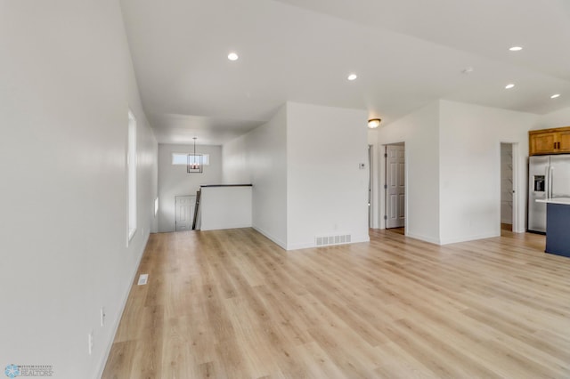 7043 Benji Ln, Fargo, ND 58047 - unfurnished living room featuring recessed lighting, light wood-style floors, and baseboards