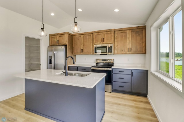 7043 Benji Ln, Fargo, ND 58047 - kitchen with stainless steel appliances, a sink, vaulted ceiling, brown cabinetry, and pendant lighting