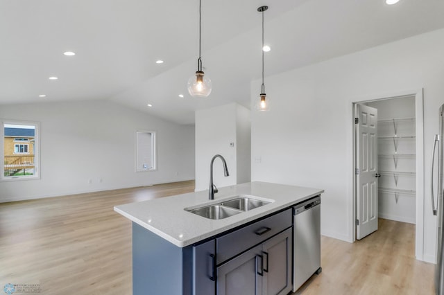7043 Benji Ln, Fargo, ND 58047 - kitchen featuring a sink, appliances with stainless steel finishes, light wood-style flooring, lofted ceiling, and hanging light fixtures
