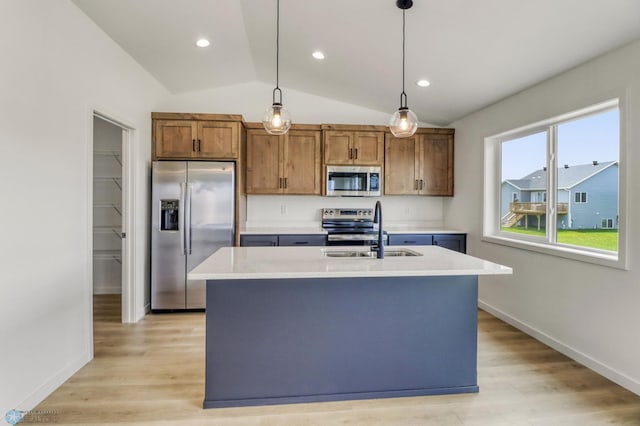 7043 Benji Ln, Fargo, ND 58047 - kitchen with appliances with stainless steel finishes, vaulted ceiling, a sink, light countertops, and brown cabinets