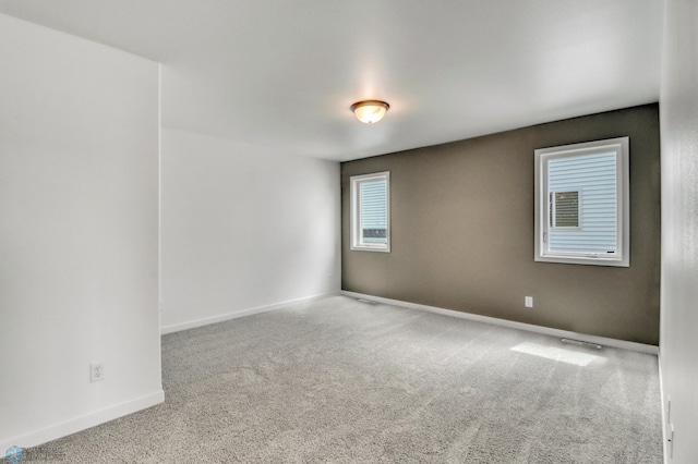 7043 Benji Ln, Fargo, ND 58047 - carpeted spare room featuring baseboards