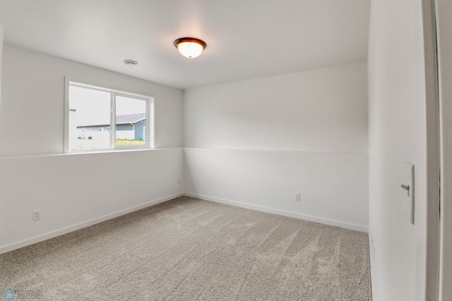 7043 Benji Ln, Fargo, ND 58047 - spare room featuring carpet flooring and baseboards