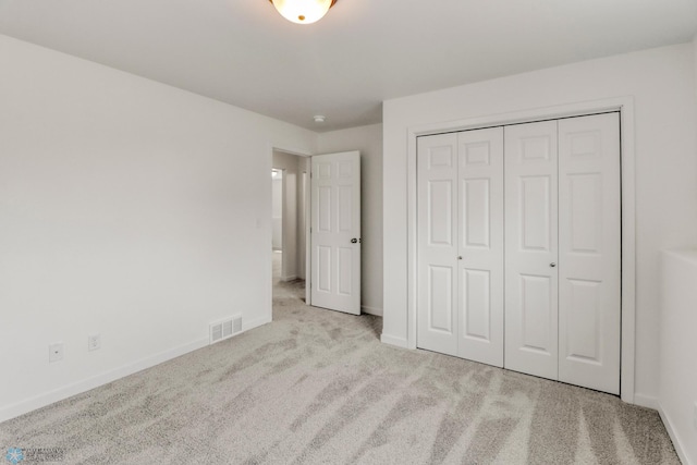7043 Benji Ln, Fargo, ND 58047 - unfurnished bedroom featuring carpet flooring, baseboards, and a closet