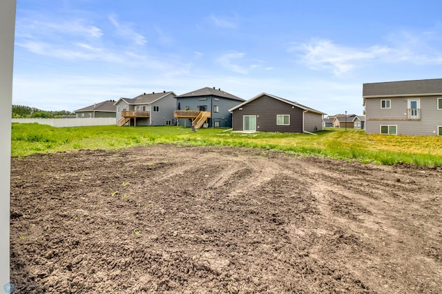 7043 Benji Ln, Fargo, ND 58047 - back of house featuring a residential view and a wooden deck