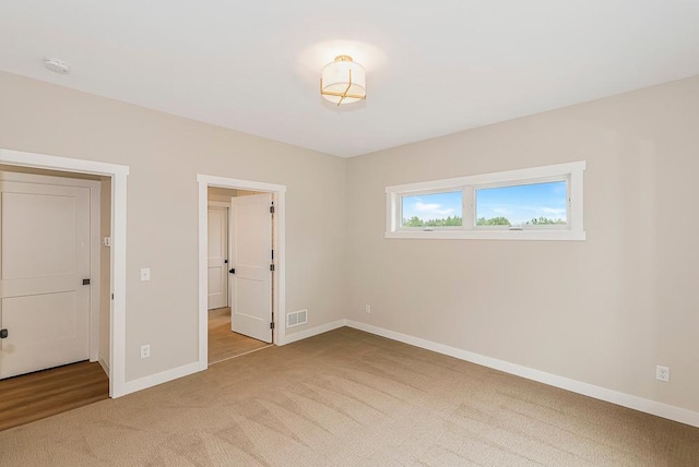 unfurnished bedroom with carpet flooring