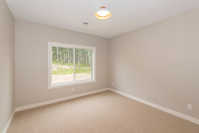 empty room featuring carpet flooring