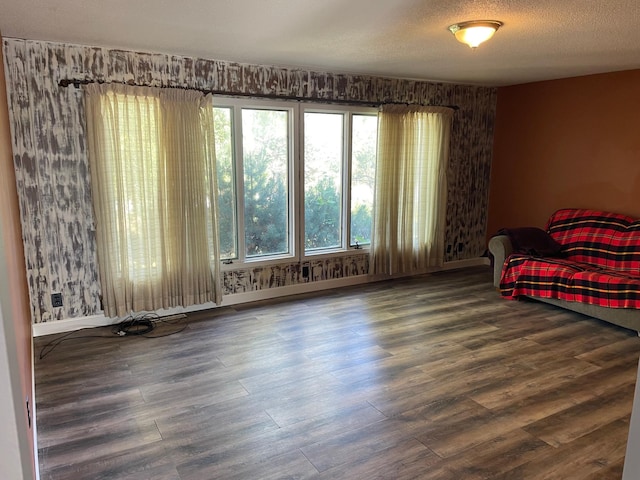 bedroom featuring hardwood / wood-style floors and a textured ceiling