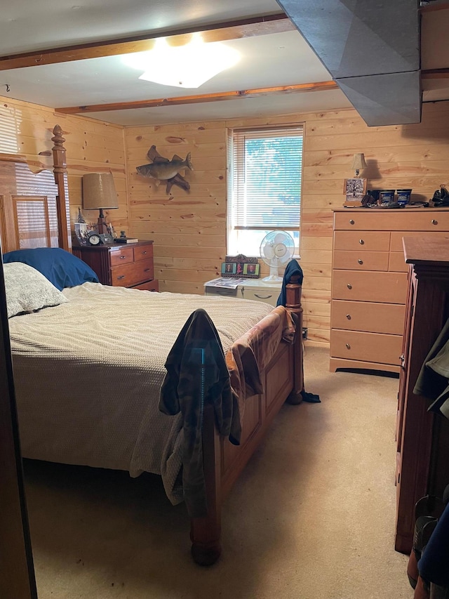 carpeted bedroom with wood walls