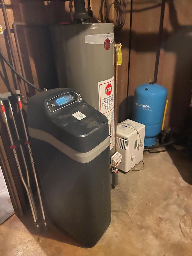 utility room with gas water heater