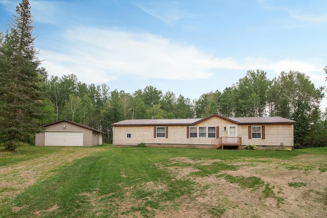 view of front of house featuring an outbuilding, metal roof, a garage, crawl space, and a front yard