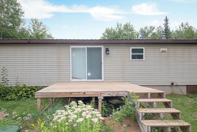 rear view of property with a wooden deck