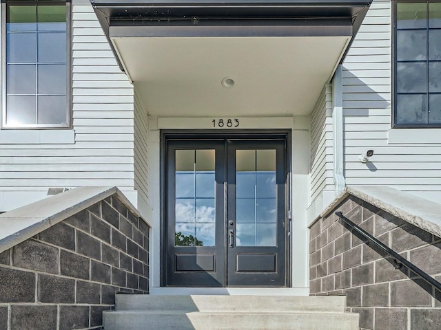 property entrance featuring french doors