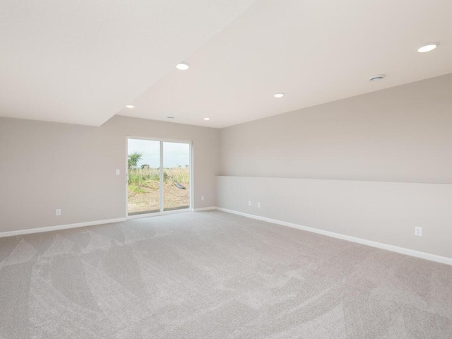 unfurnished room with light carpet, baseboards, and recessed lighting